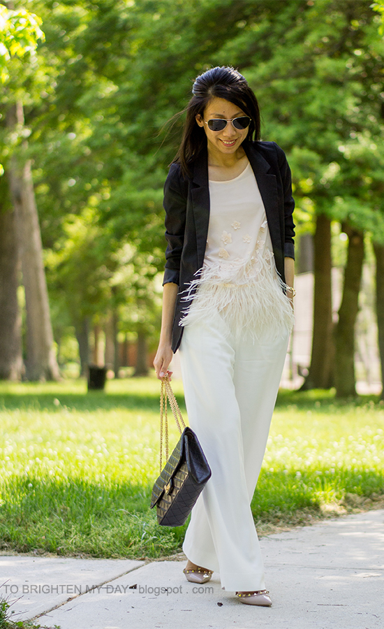 black blazer, feathered top, white trousers