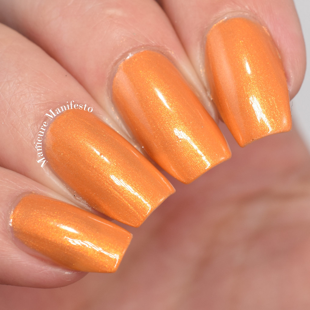 Orange shimmer nail polish