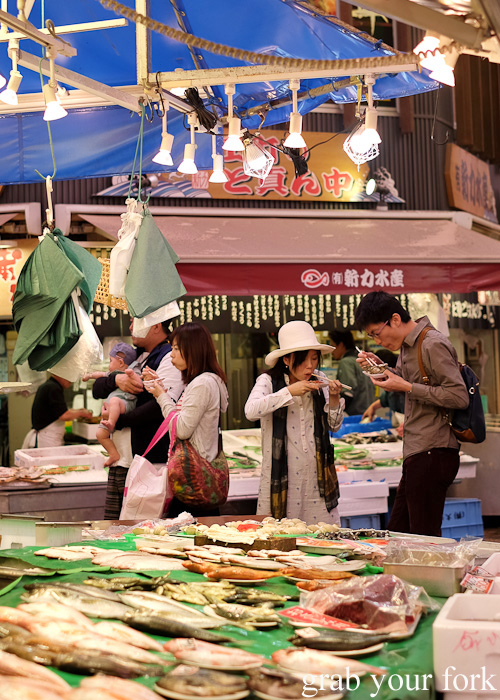 Eating fresh seafood at Omicho Market, Kanazawa, Japan