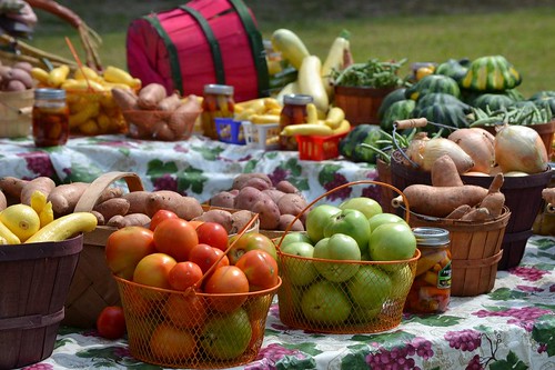 Baskets of fruits and vegetables on tables