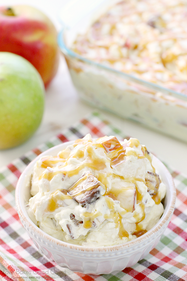 Caramel Apple Snickers Salad in a bowl with fresh fruit.