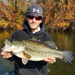 Photo of Man holding nice sized largemouth bass