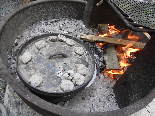 Dutch oven cooking on campground fire ring.