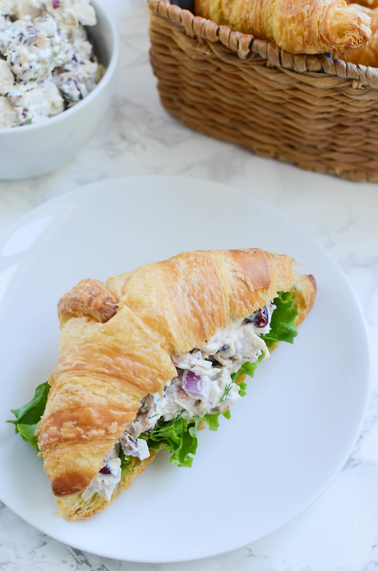 Cranberry Turkey Salad -turkey, red onion, pecans, and dried cranberries in a creamy dressing and served on croissants. A great way to use leftover Thanksgiving turkey!
