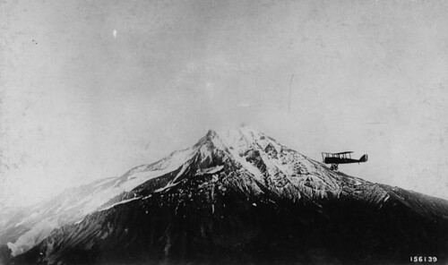 Airplane fire patrol circling Mt. Jefferson in the Cascade Range. (Credit U.S. Army Air Service 1920.)
