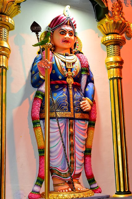 A statue figurine on the wall of the temple 