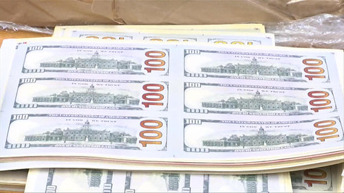 Sheets of fake $100 bills