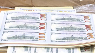Sheets of fake $100 bills