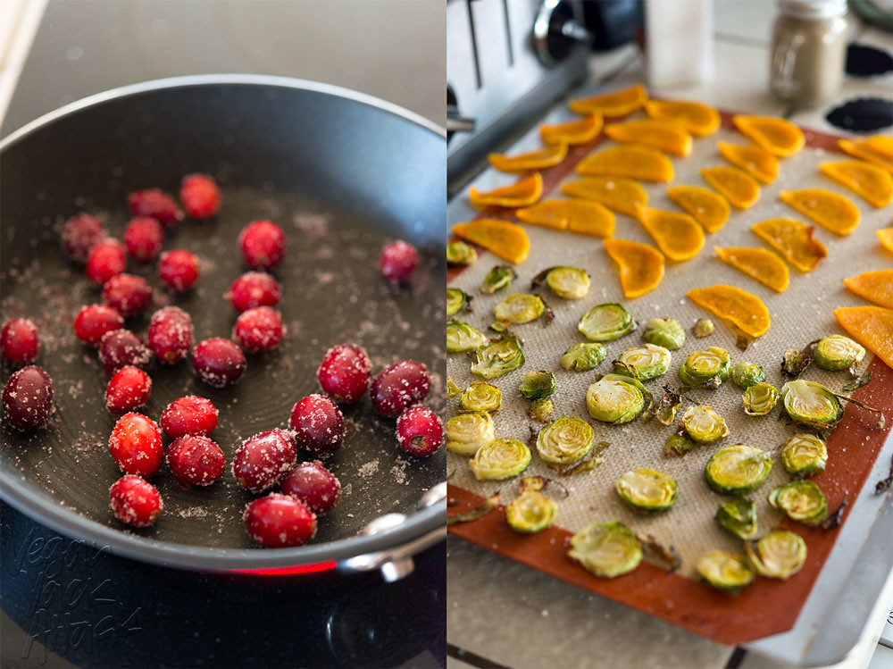 Sugared cranberries in a small pan on the left, with a baking sheet of roasted Brussels and squash pieces on the right
