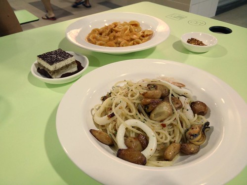 Clockwise from bottom: aglio olio seafood, tiramisu, and chicken pasta