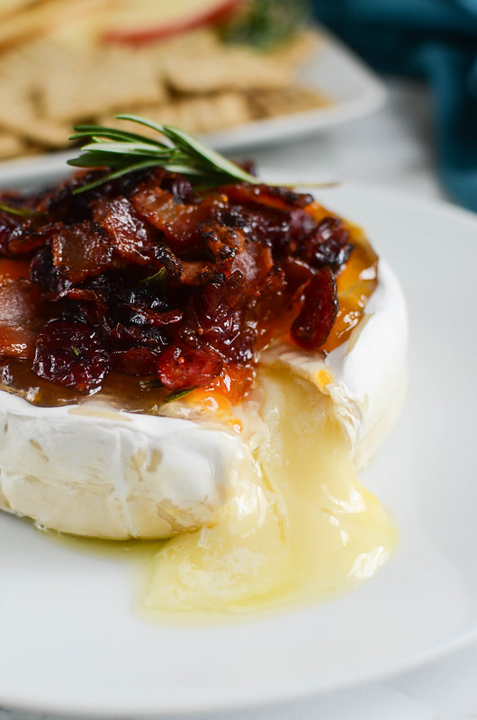 Bacon Cranberry Baked Brie - the perfect holiday appetizer! The sweet and salty combo is so delicious!