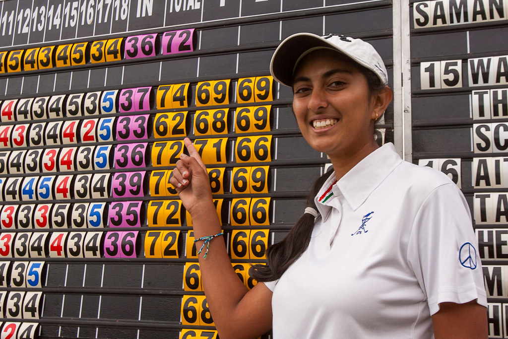 Aditi Ashok of India points to her course equalling record of 62 at after the third round at Samanah Golf Club | by Ladies European Tour