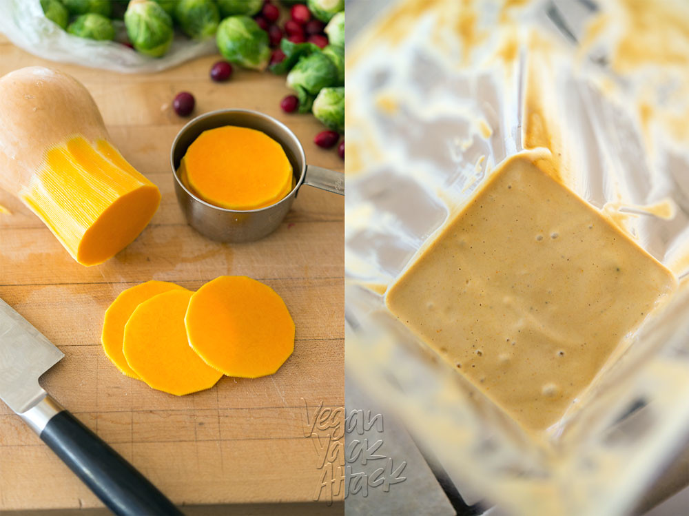Sliced butternut squash on the left, next to a knife, on a wood counter top. Blended, creamy dressing in a blender pitcher, on the right.
