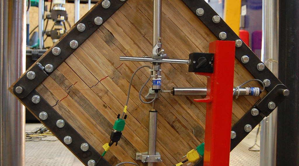 An engineered bamboo panel has its mechanical properties tested.