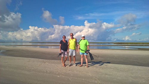 Photo of volunteers cleaning up beach at Janes Island State Park