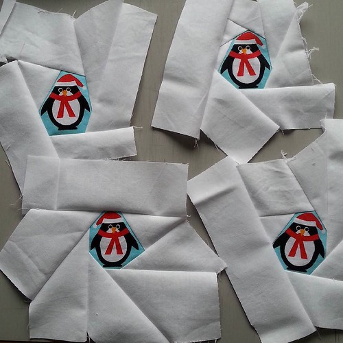 Four penguins. Another 32 to go. I'm going to trim them to 3.5" square (but not centre the penguin) and then piece them into a #Christmascushionalong top. The bits I cut off these will be used to surround other penguins.