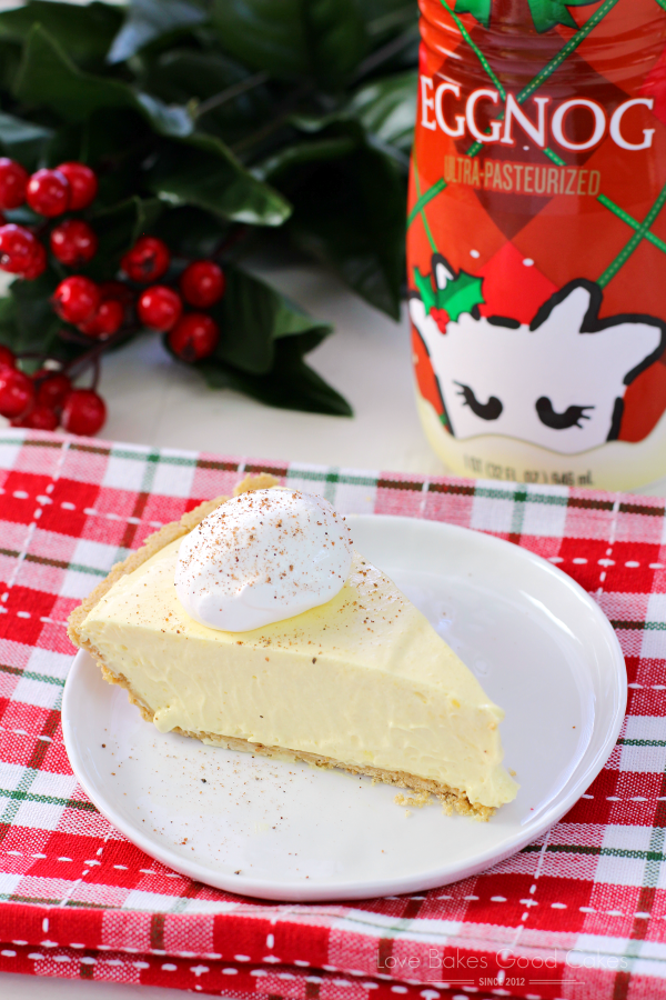 No-Bake Eggnog Pie on a white plate with a bottle of eggnog.