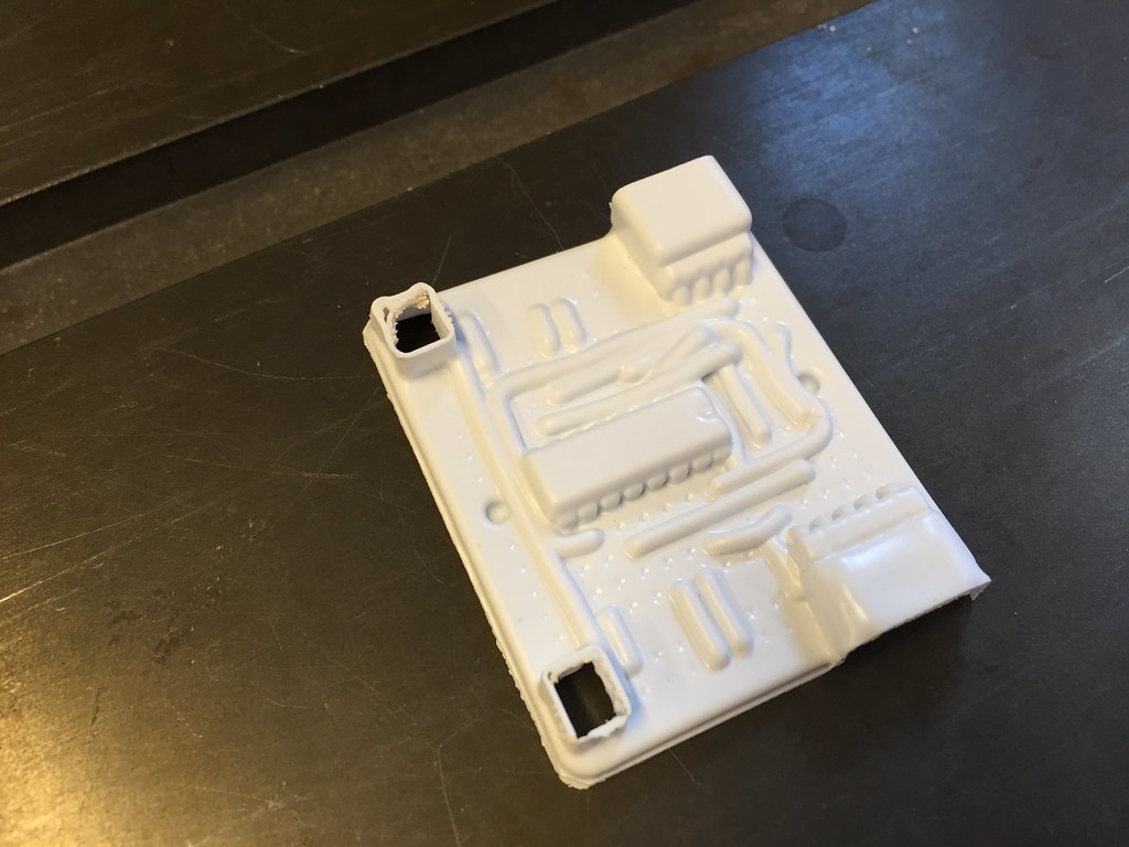 Roughly cut out plastic vacuum formed over a circuit board 