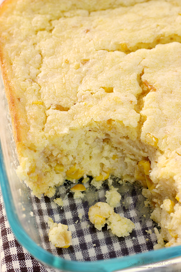 Easy Corn Casserole in a baking pan with a corner piece removed.
