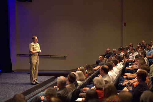Navy Adm. Michael Rogers talks to an audience in an auditorium.