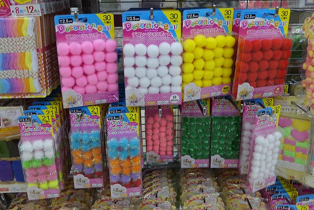 Assortment of pom pom balls in the Daiso store. 