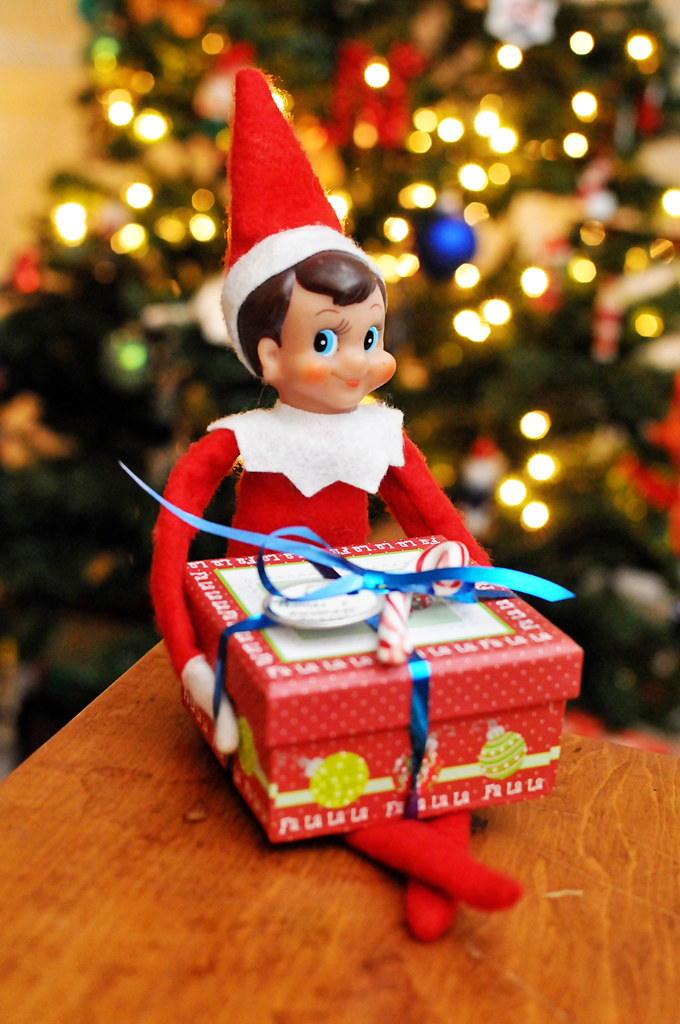 An elf bearing a gift | a box of chocolate coins | Flickr