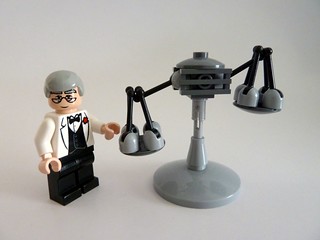 A Lego scientist-looking dude and a cleverly-made Lego scales.