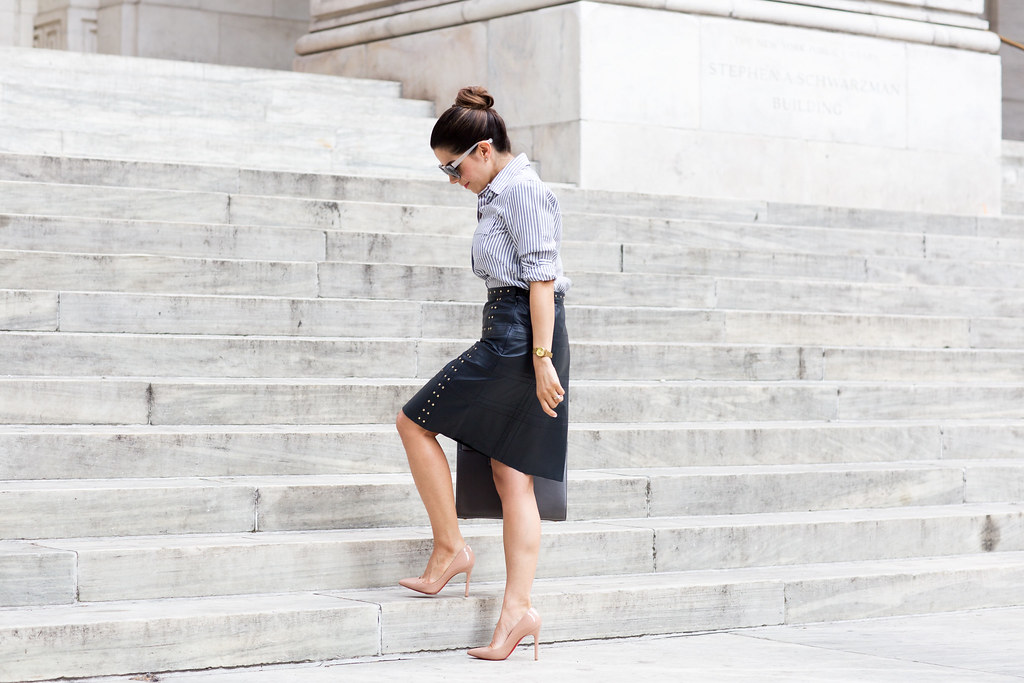 how to wear leather to work leather navy skirt with a stripe button down shirt with worth new york in the spring