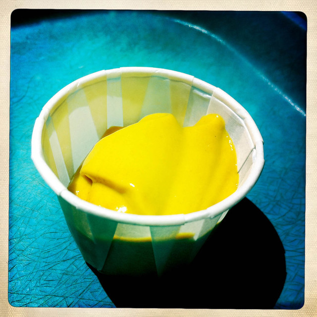 Yellow mustard in a cup
