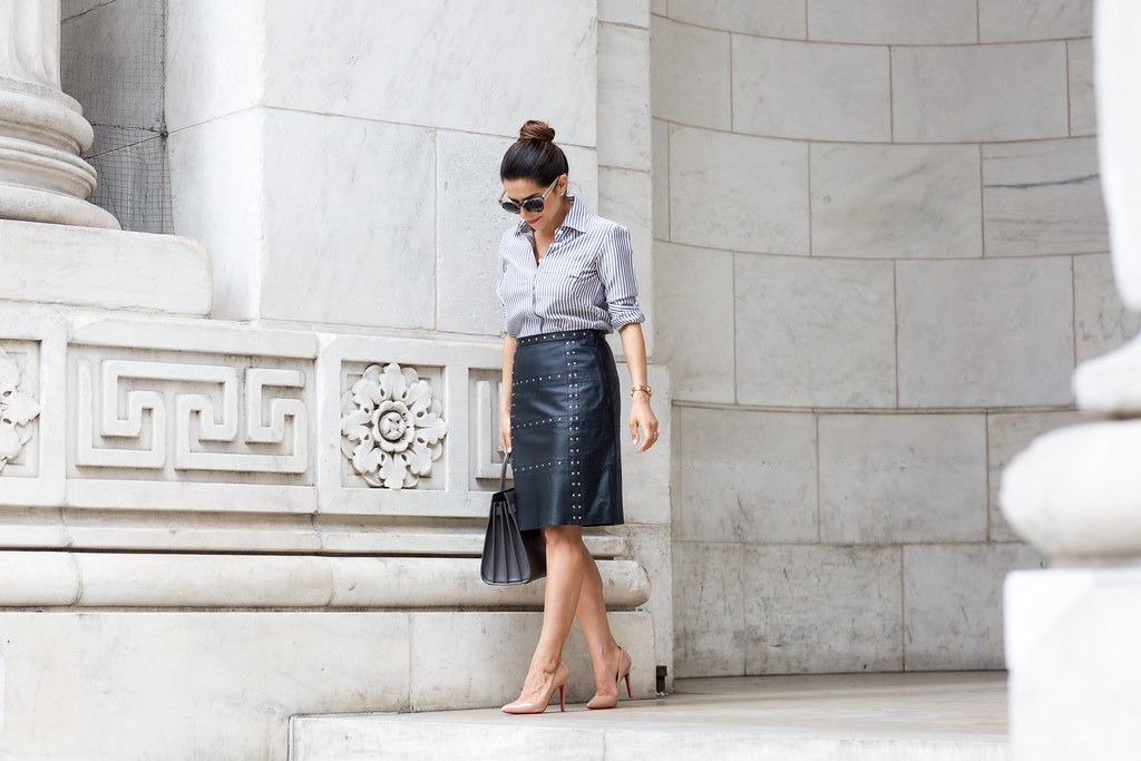 how to wear leather to work leather navy skirt with a stripe button down shirt with worth new york in the spring