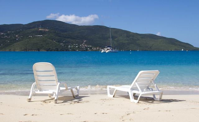 White Lounge Chair On Tropical Beach