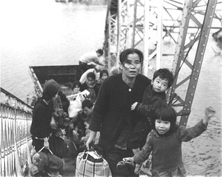 1968 Refugees crossing the Perfume River at Truong Tien Bridge outside of Hue.