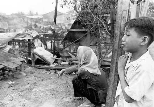 Mother and son survey their remains of their homes in Cholon destroyed during the May 5 Communist offensive in the Saigon area
