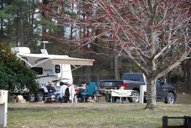 A family enjoying a meal outside at Kiptopeke State Park campground in Virginia