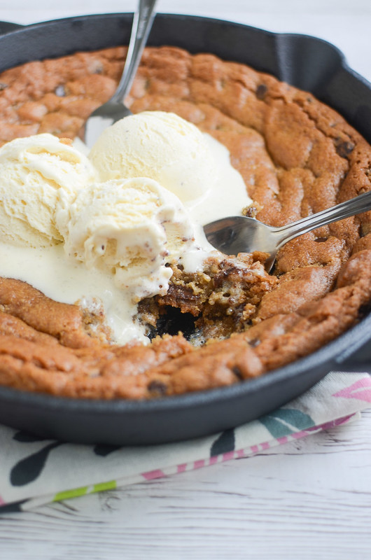 Chocolate Chip Pizookie - chocolate chip cookie dough baked in a skillet and topped with vanilla ice cream! Just serve it in the skillet and let everyone dig in! 