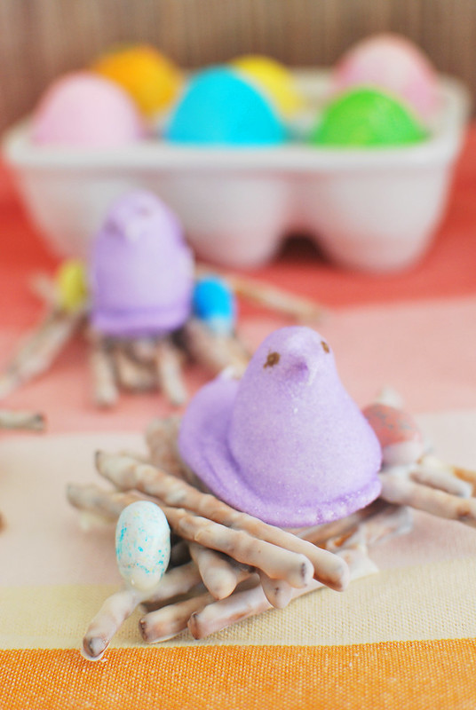 Peeps Nests - the cutest Easter treat! White chocolate covered pretzels with Peeps and candy eggs on top. No bake and perfect for school Easter parties! 