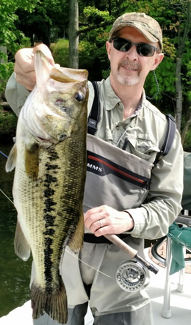 Photo courtesy of Ken Pavol, Stan Komacek holding a largemouth Bass
