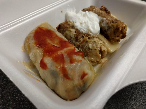 Cabbage roll, pierogi, and some kind of meat roll