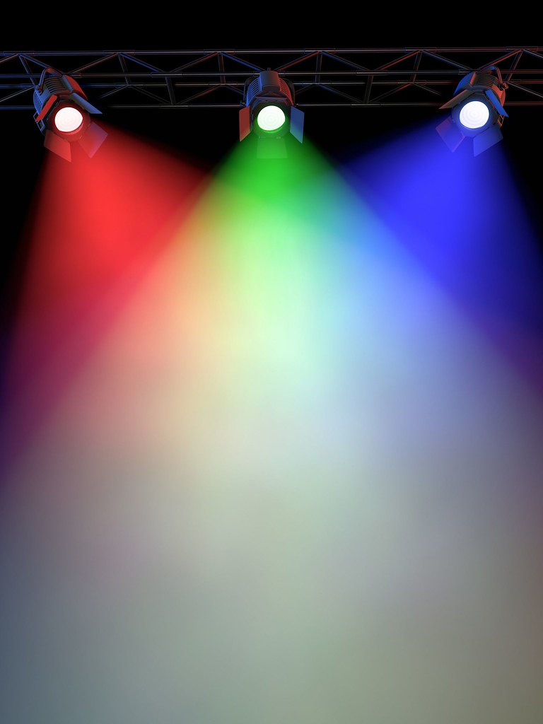 _a-stage-light-rack-with-3-colored-spotlights-shining-down… | Flickr