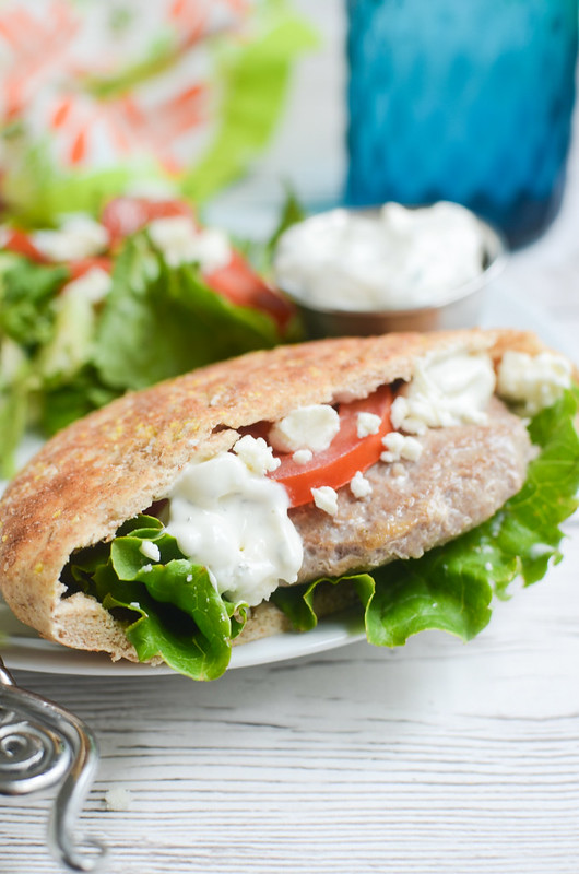 Greek Turkey Burgers - delicious burgers in pitas with feta and homemade tzatziki sauce! Plus, the best tips for keeping turkey burgers from drying out!