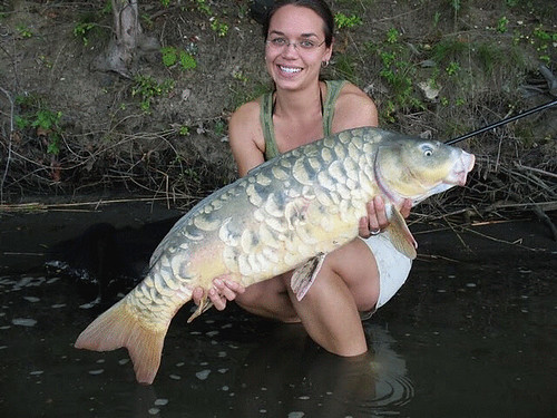 Photo of woman with large carp