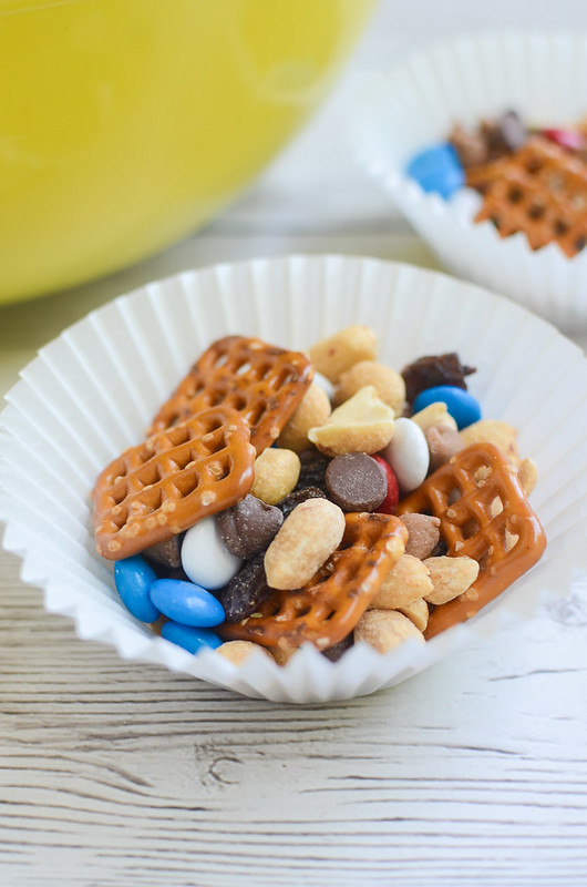 Monster Trail Mix - the ultimate roadtrip snack mix! Pretzels, chocolate chips, peanut butter chips, raisins, peanuts, and M&Ms! 