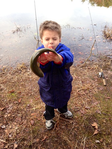 Photo of Boy losing his grip on a trout.