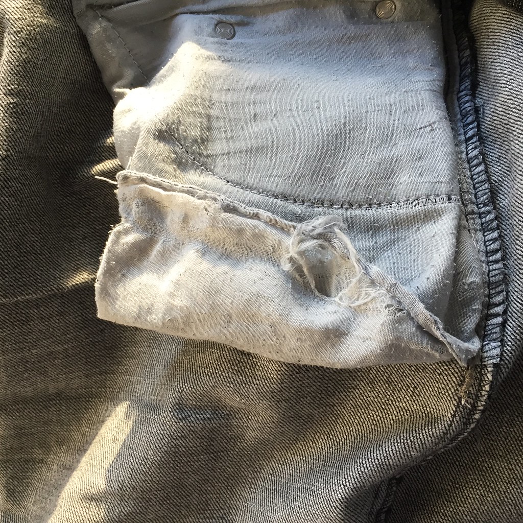 pockets of bb's jeans looking threadbare and holey