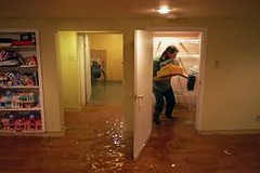 Water flooding in the hallway of a house.