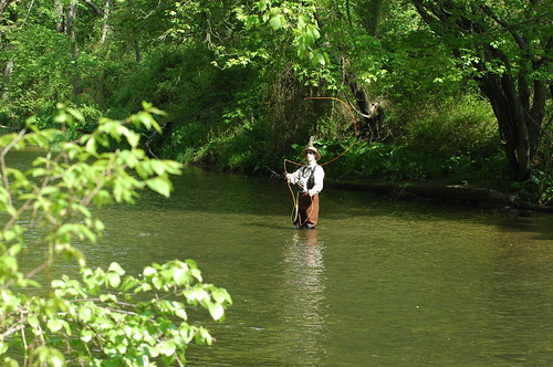 Man fishing in stream