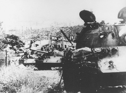 An loc 1972 - One block down the street, five T-54 tanks lay gutted in parade formation