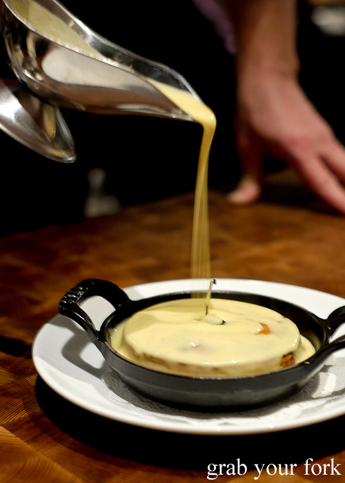 Pouring vanilla sauce on the Gateaux Basque at Mercado restaurant, Sydney