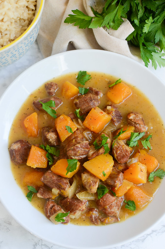 Slow Cooker Pork and Butternut Squash Stew - a bowl of comfort! Quickly brown the pork and then toss everything in the slow cooker! 