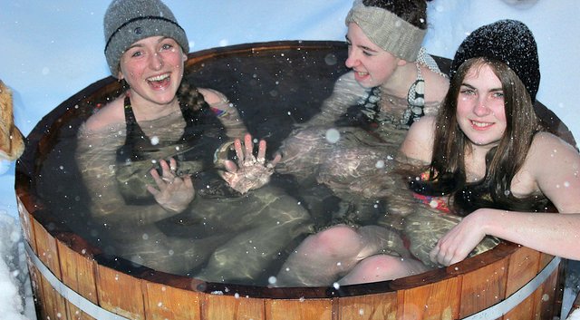 Cabot Shores' young guests in cedar hot tub